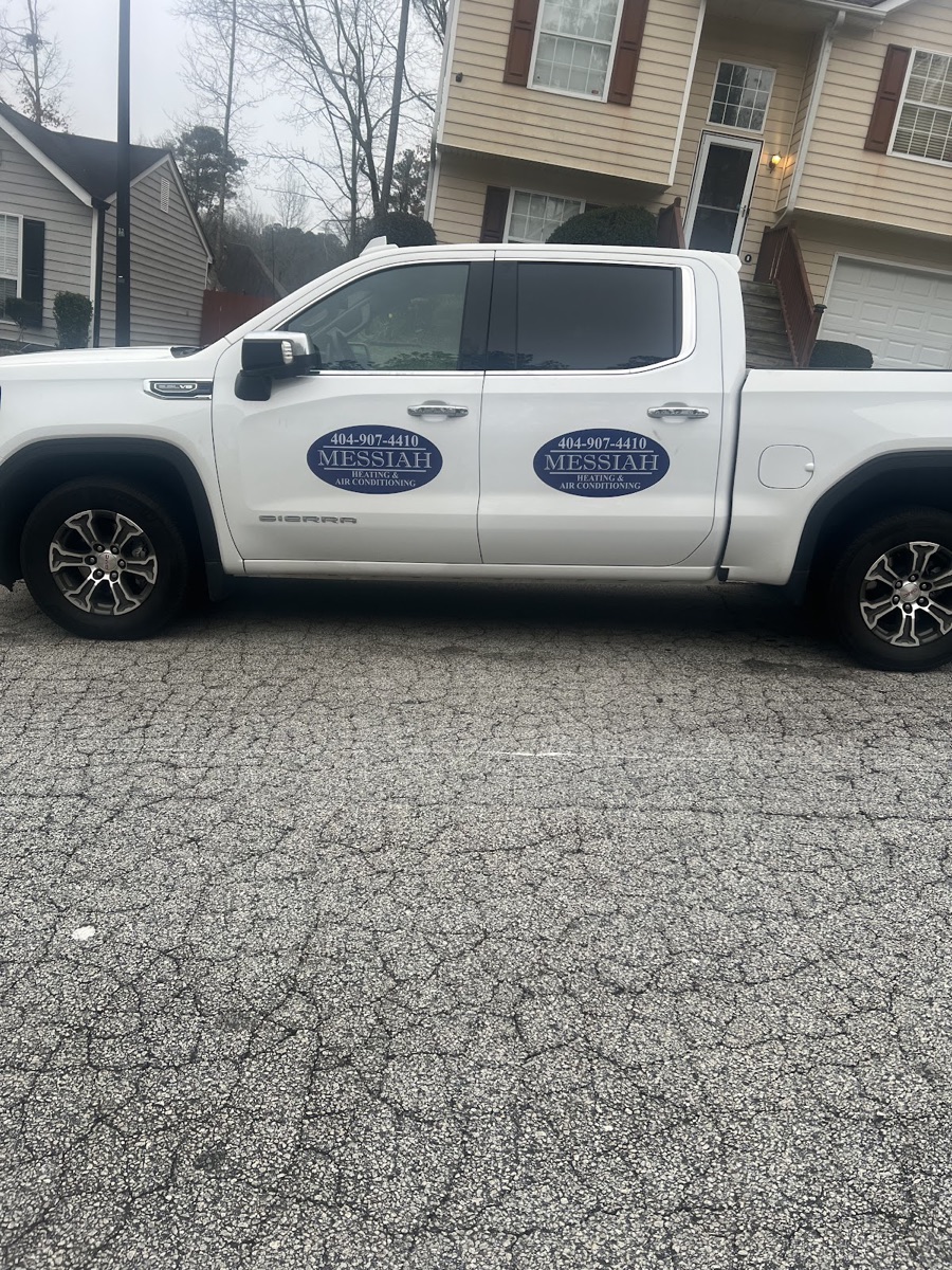 Messiah Heating & Air Conditioning branded service truck in a Decatur driveway